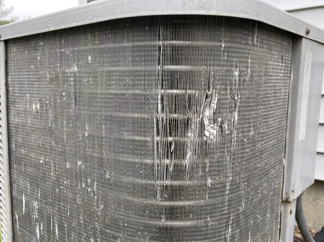 The same condenser coil after rinsing, fins clear of debris